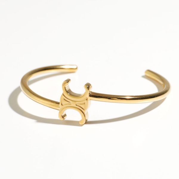 셀린느 TRIOMPHE ASYMMETRIC CUFF IN BRASS WITH GOLD FINISH 150257790